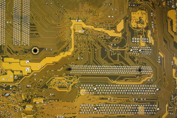 Fondo de textura de placa de circuito impreso amarillo-marrón . — Foto de Stock