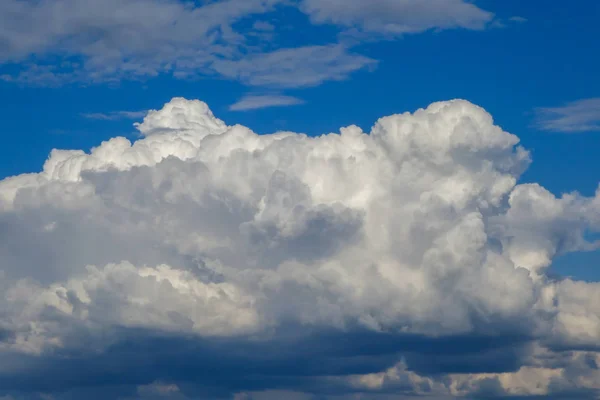 Approach of a storm front. White, gray, blue cloud. Storm clouds with rain