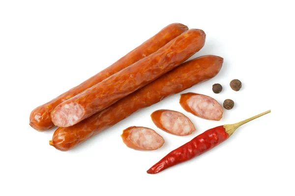 Сосиски зі спеціями та червоним перцем, вид зверху на білому тлі — стокове фото