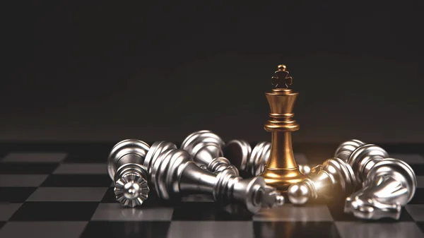 King golden chess standing in the middle of the falling silver on chess board concepts of leadership and business strategy management and leadership.