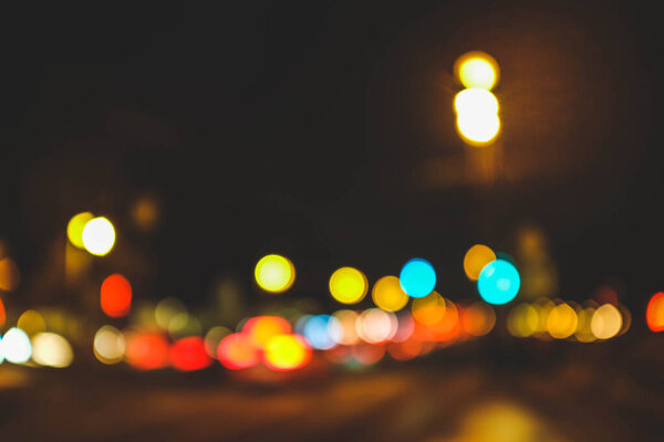 Background. Multi color round bokeh of night city road.