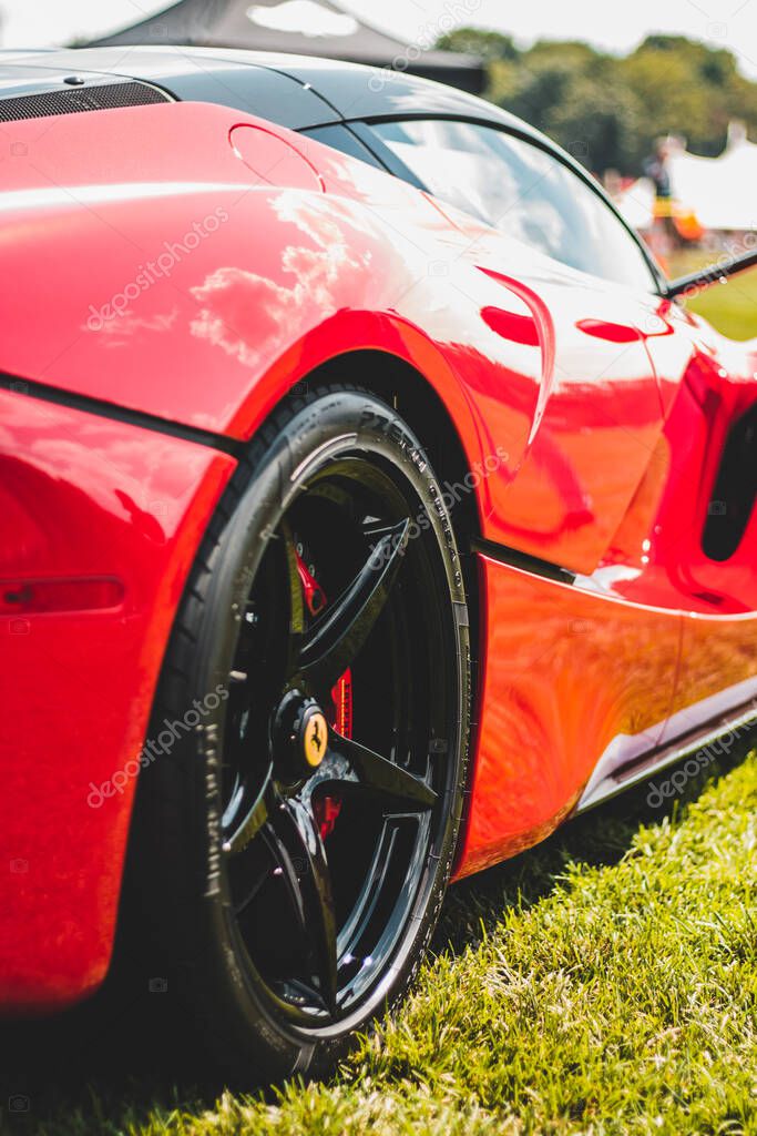The Farmington Polo Grounds, Farmington, CT USA - August 22, 2020: Rear side wheel view of red Ferrari Race Car. The Dream Ride Club.
