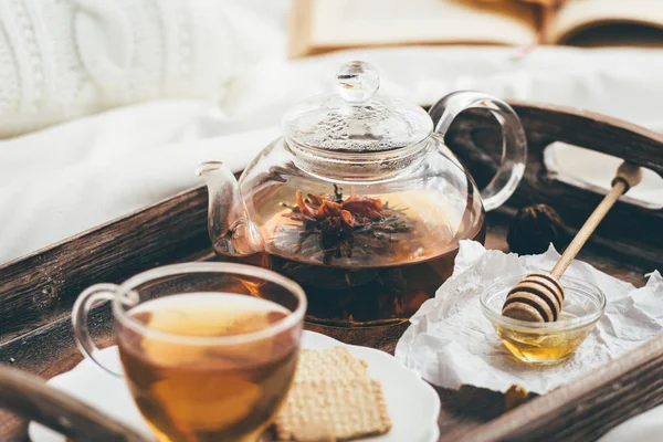 Warming tea in bed. Window light