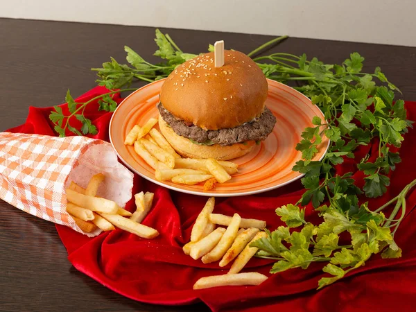 white burger on a light background, with fries
