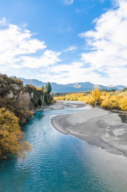 Beautiful view from the Historic Bridge over Shotover River in Arrowtown, New Zealand. clipart