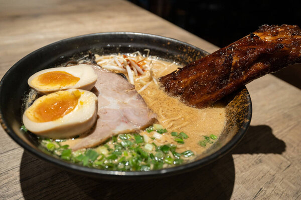 Pork broth based ramen topped with grilled marinated pork rib, slow cooked charsiu and soft boiled egg.