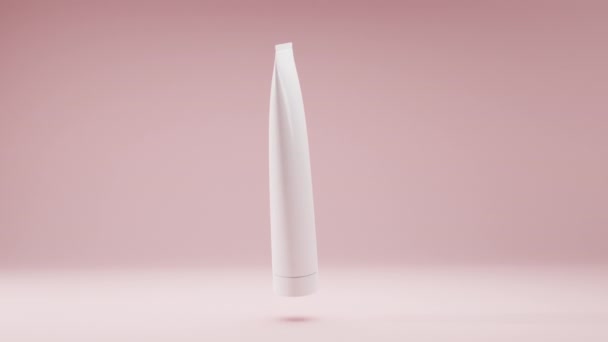Косметический белый пакет, пластиковая трубка для bb-cream, скраб, тоник, зубная паста, уход за телом. Реалистичная бутылка 3D модели на мягком розовом фоне медленно вращается в воздухе для дизайна продукта и рекламы — стоковое видео