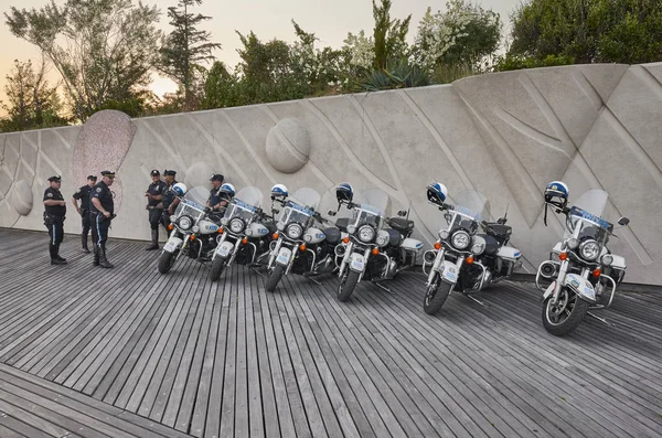 NYPD Highway Patrol officers and motorcycles on the Coney Island beach boardwalk at sunset. — 图库照片