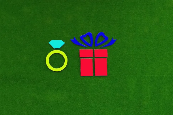 Gift box, diamond ring on green background. Jewelry, expensive gift.