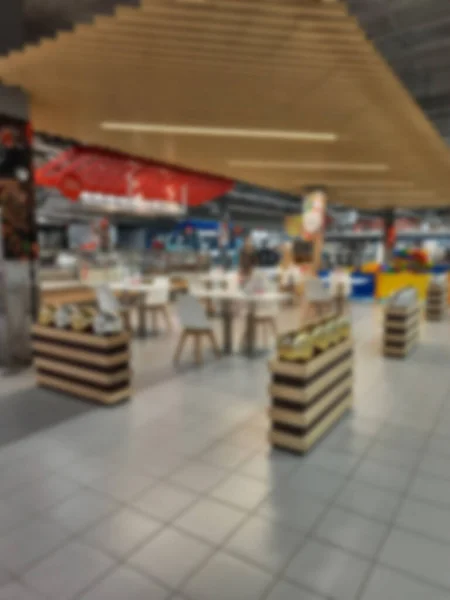 Blurred background of the cafe inside the room. Public catering, canteen.