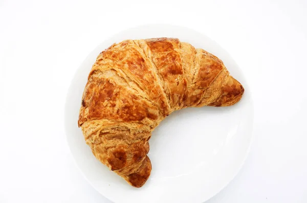 Pékség Croissant ellen a fehér háttere — Stock Fotó