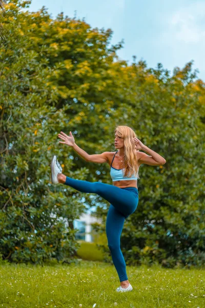 Fitness Yoga Session Young Blonde Caucasian Instructor Dressed Casual  Outfit Stock Photo by ©unaihuizi@gmail.com 389580438