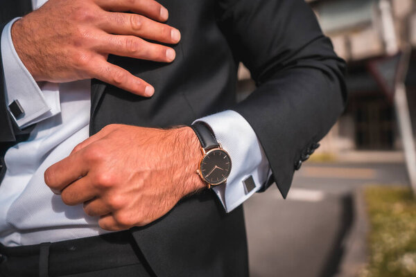 cropped portrait of attractive man in stylish black suit 