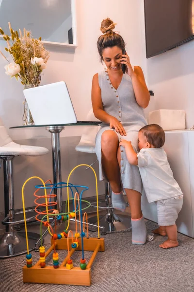 Young Caucasian Mother Caring Her Young Son Teleworking Home Closed — Stock Photo, Image