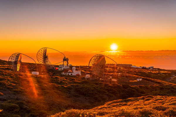 The new astronomical observatory of the Caldera de Taburiente in a beautiful orange sunset, La Palma, Canary Islands. Spain
