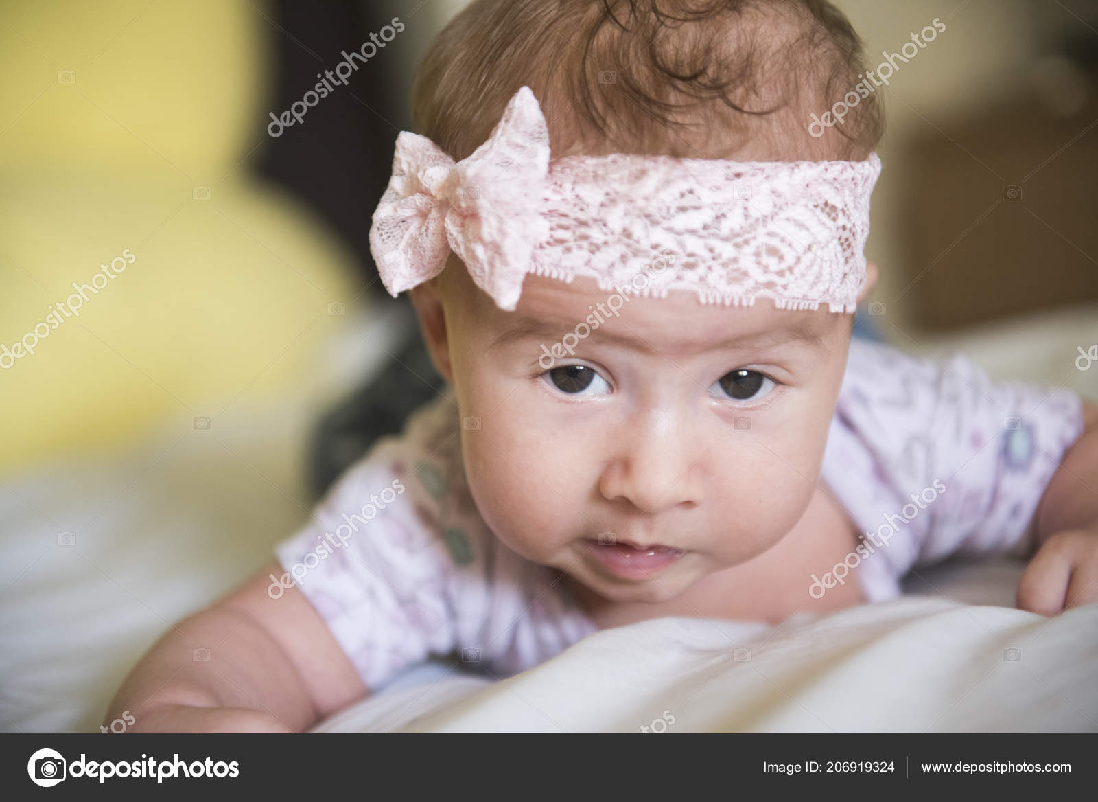 baby with bow on head