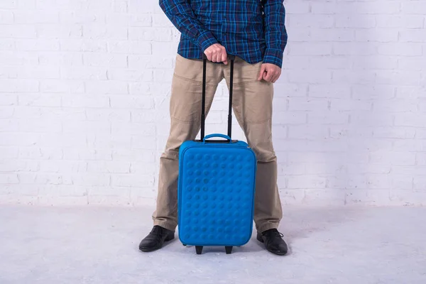 Man with suitcase near brick wall. Space for text — Stock Photo, Image