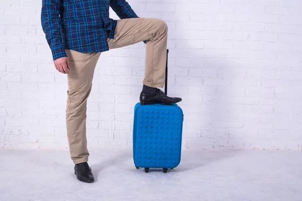 Man with suitcase near brick wall. Space for text — Stock Photo, Image