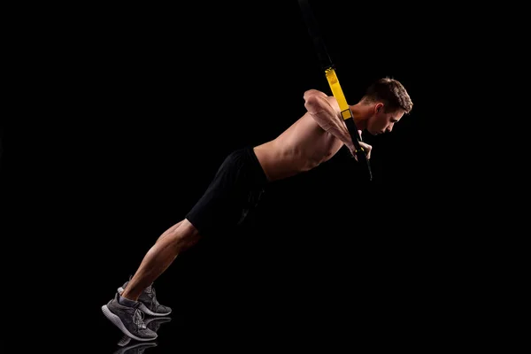 Young Muscular Man Exercising Trx Fitness Straps Isolated Black Background — Stock Photo, Image
