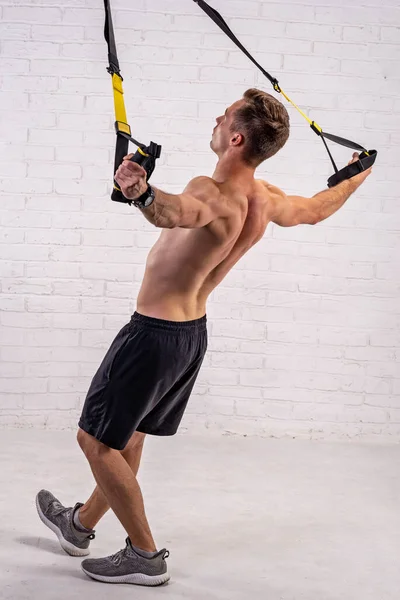 Muscular Young Man Doing Exercises Trx Straps White Brick Wall — Stock Photo, Image