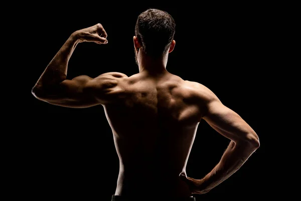 Strong Muscular Man Showing Biceps Back View Isolated Black Background — Stock Photo, Image