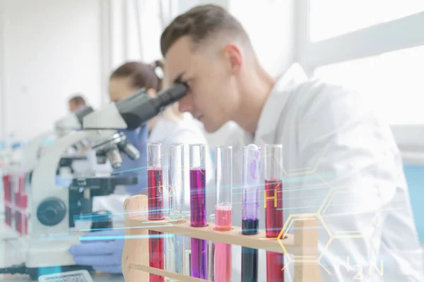 Group of young Laboratory scientists working at lab with test tu — Stock Photo, Image