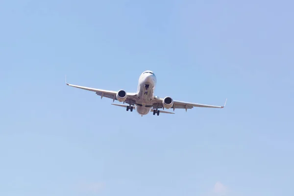 Passenger airplane landing in the airport runway. Passenger plan