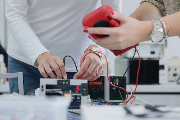 Two young students in technical vocational training, the lesson