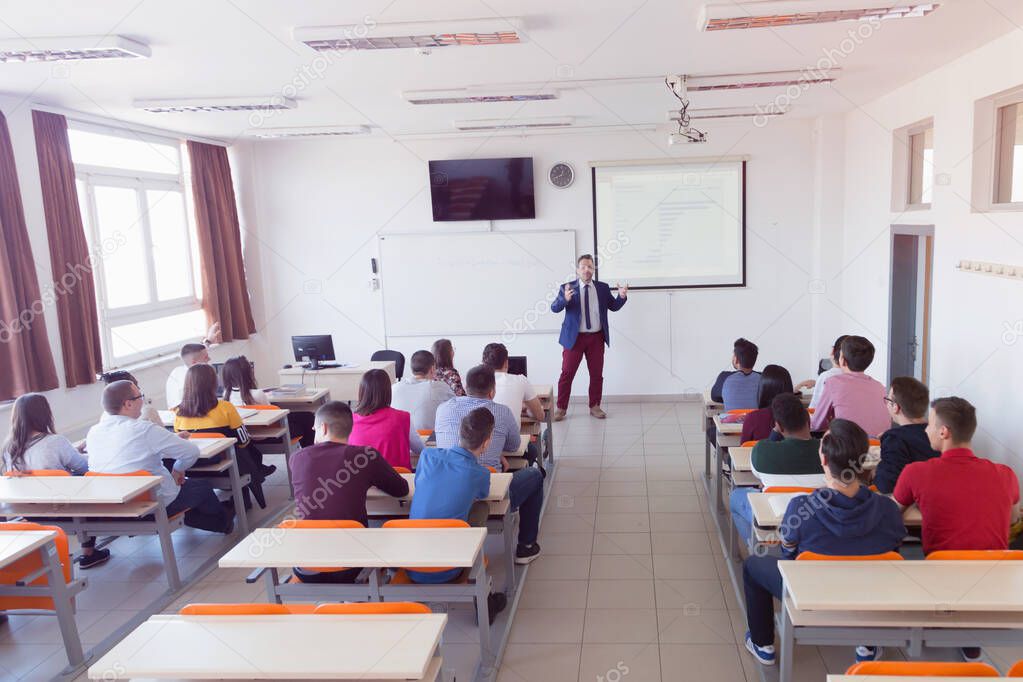 Male professor explain lesson to students and interact with them