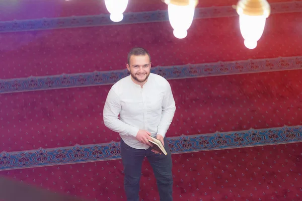 Religious muslim man praying inside the beautiful big mosque. St