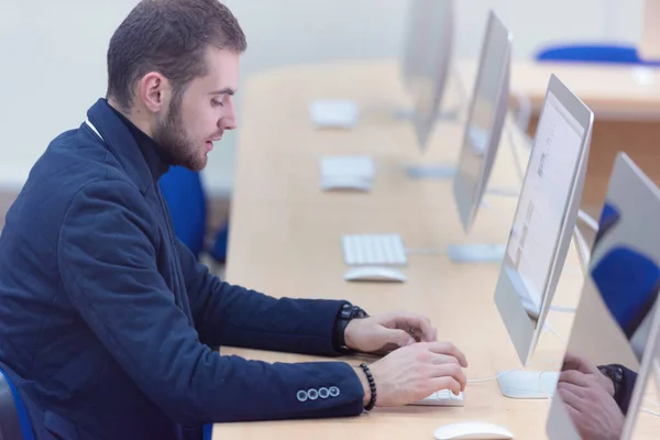 Programming. Man Working On Computer In IT Office, Sitting At De