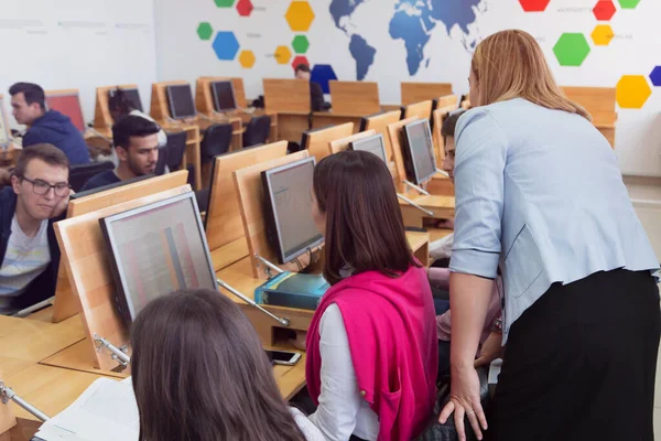 Female attractive professor explain lesson to students and inter