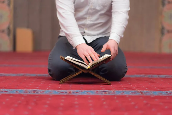 Religious muslim man praying inside the beautiful big mosque, re