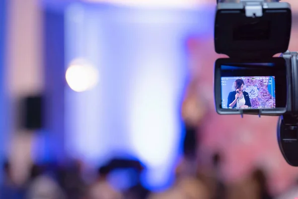 Beautiful business woman with microphone in her hand speaking at — Stock Photo, Image