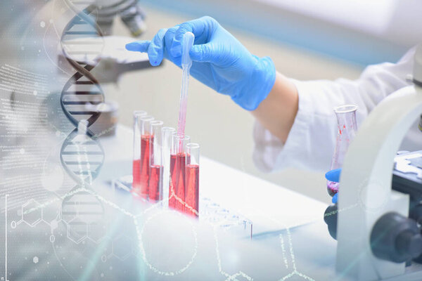 Young female Laboratory scientist working at lab with test tubes