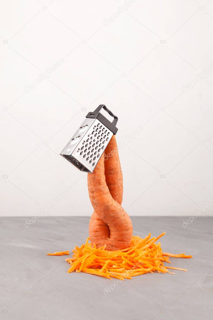 Ugly vegetables. An unusual fused carrot and grated.  Selective focus, copy space. Concept - Food organic waste reduction. Using in cooking imperfect products.