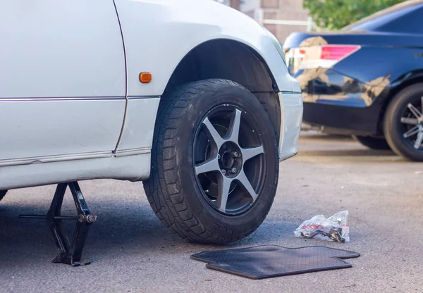 car tire repair, crushed car in the outdoor