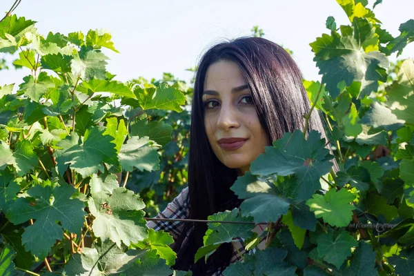 portrait of a woman in a vineyard