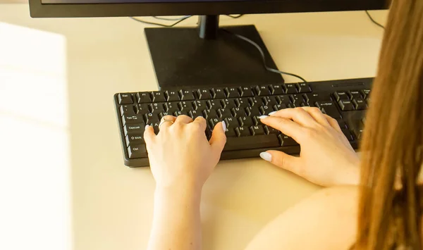 hands on keyboard, hands typing on a keyboard