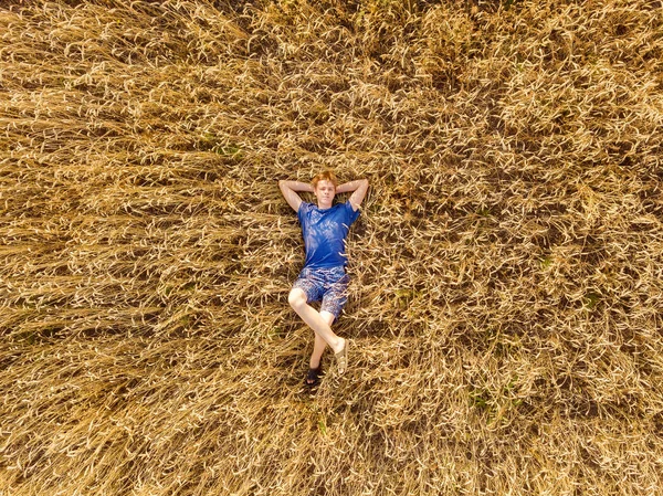 Aerial Drone View Boy Lies His Back Field Wheat Harvest — Stock Photo, Image