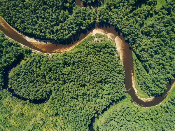 Aerial drone view, the bend of the river with sandy stretches of deep forest on a Sunny day.