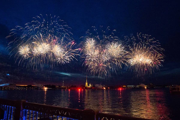 Colorful fireworks at night in St. Petersburg over the Neva for the annual celebration school graduates 