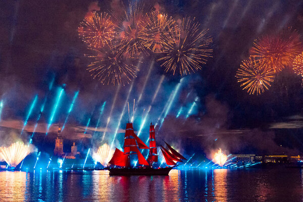 Saint-Petersburg, Russia-June 23,2018 Swedish brig Tre Krunur on the annual celebration school graduates Scarlet Sails in St. Petersburg. Festive fireworks and light show over the Neva river.