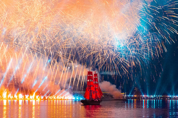 Saint-Petersburg, Russia-June 23,2018 Swedish brig Tre Krunur on the annual celebration school graduates Scarlet Sails in St. Petersburg. Festive fireworks and light show over the Neva river.