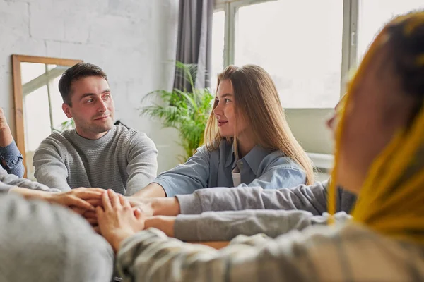 Club members hold hands of each other in the circle — Stock Photo, Image