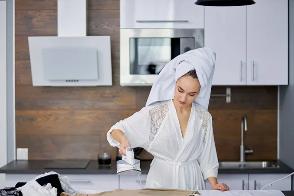 Young lady is ironing clothes after bath — Stock Photo, Image