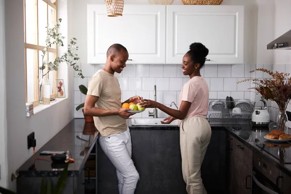 kind careful man with wife in the kitchen