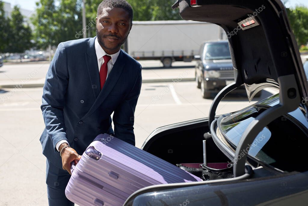 confident black transfer carry suitcases of clients