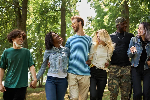 friendly group of mixed race people have fun outdoors