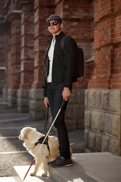 Portrait of blind man with cane for the disabled and dog on leash — Stock Photo, Image